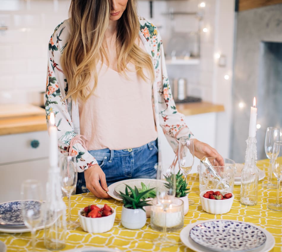 Resident preparing a healthy meal in her fully equipped kitchen at Terra Camarillo in Camarillo, California