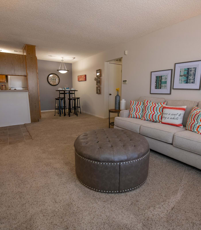 Carpeted living room at Tammaron Village Apartments in Oklahoma City, Oklahoma