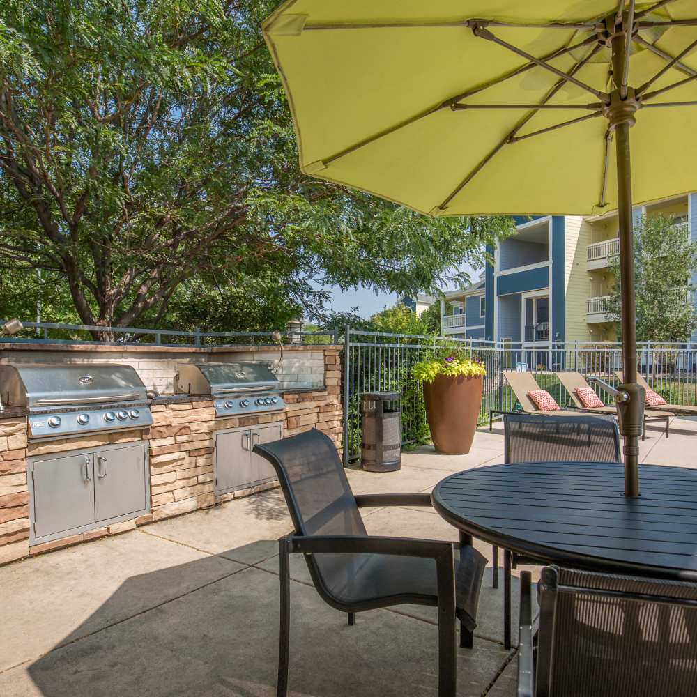 Barbeque with canopy seating at One Belmar Place in Lakewood, Colorado