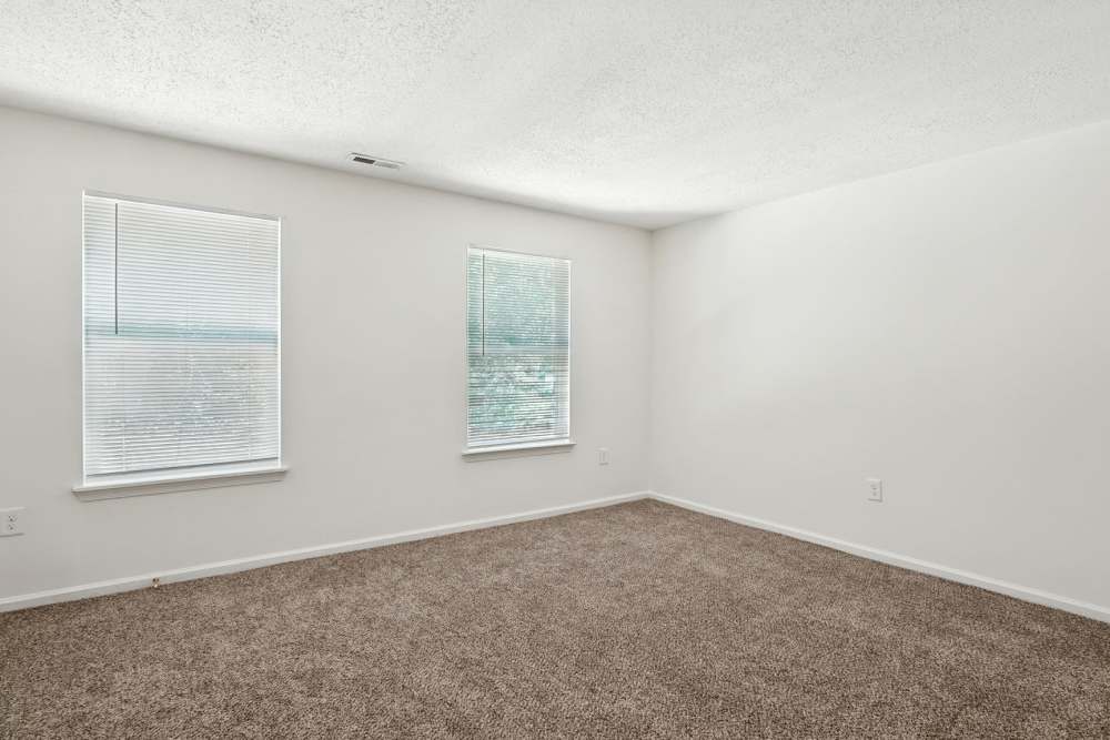 Bedroom with carpet flooring at Monmouth Woods in King George,Virginia