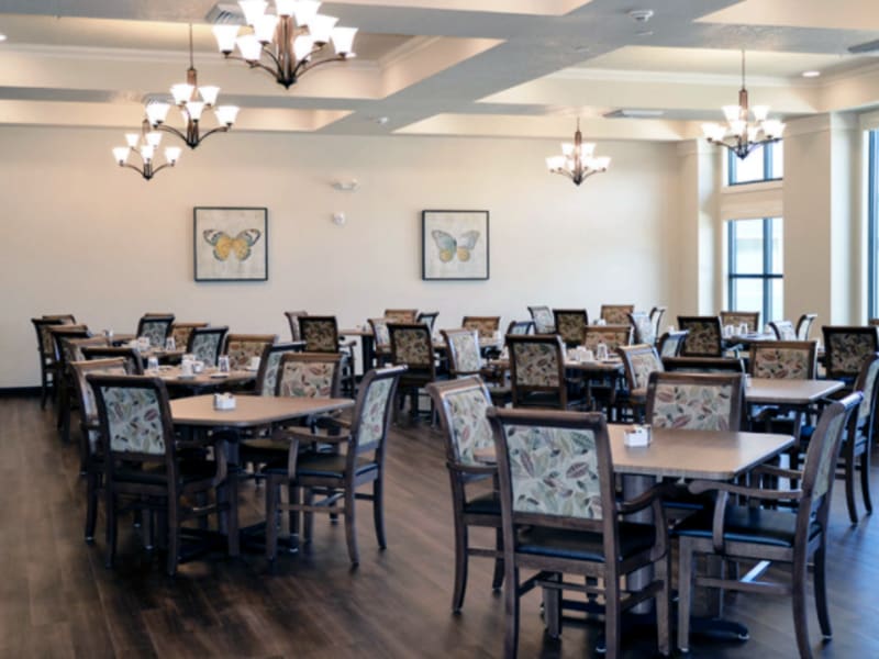 Dining hall with dark hard wood flooring at Aspen Valley Senior Living in Boise, Idaho