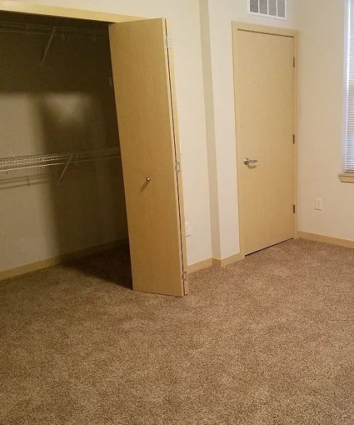 Spacious walk-in closet in the bedroom of an apartment at Mill Creek Apartments in Cross Plains, Wisconsin