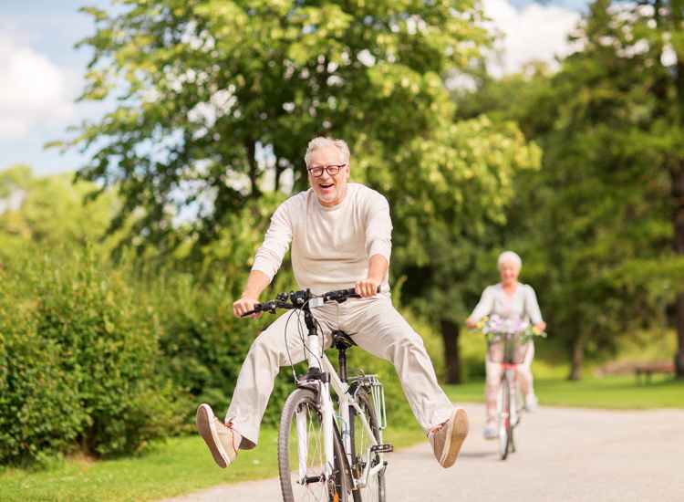 A senior enjoying a bike ride at Grinnell Mansion in New Bedford,Massachusetts