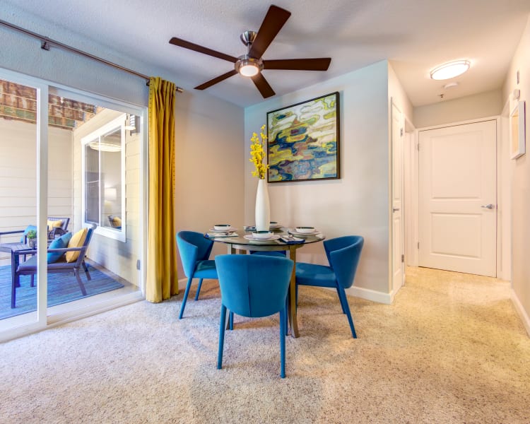 Dining area with sliding doors to the private patio outside a model home at Sofi Sunnyvale in Sunnyvale, California