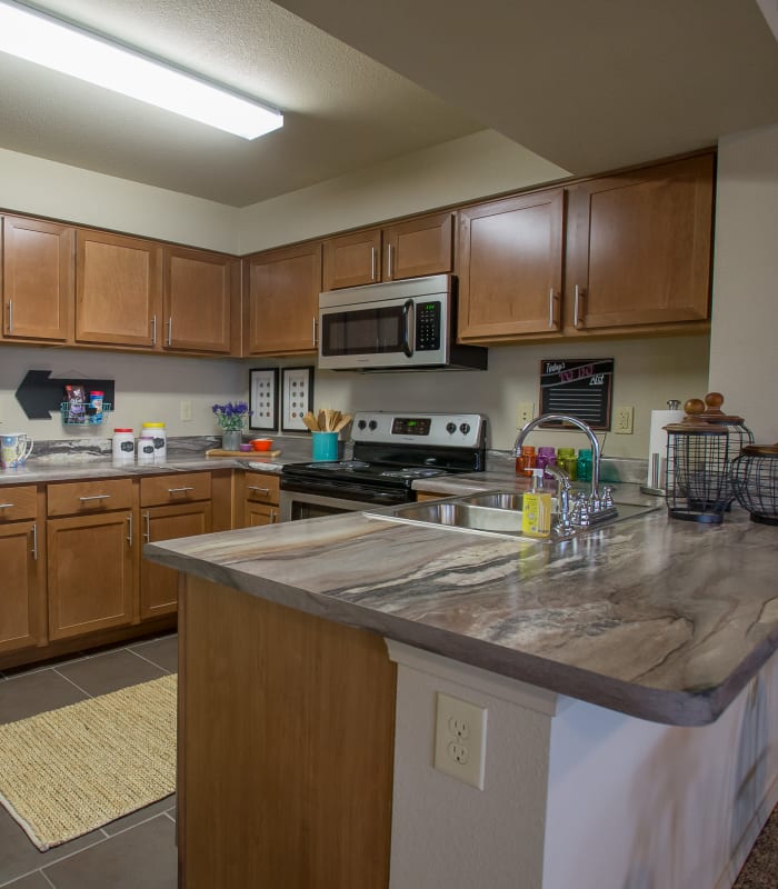 Kitchen with granite countertops at Portofino Apartments in Wichita, Kansas