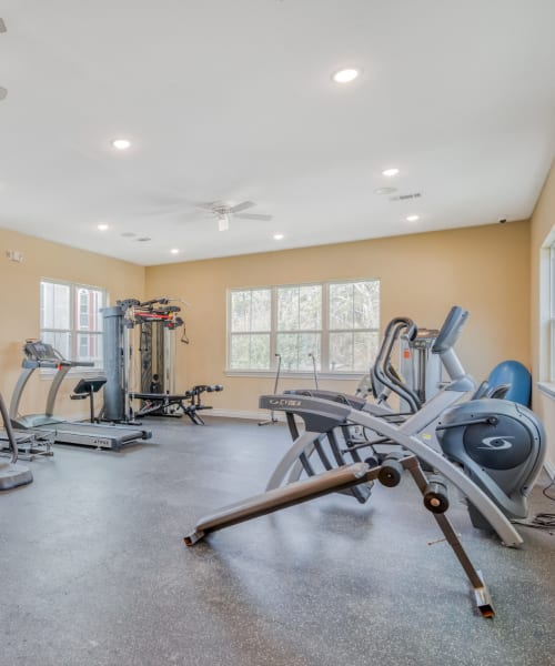 Exercise equipment in the fitness center at Huntsville Village Apartments in Huntsville, Texas
