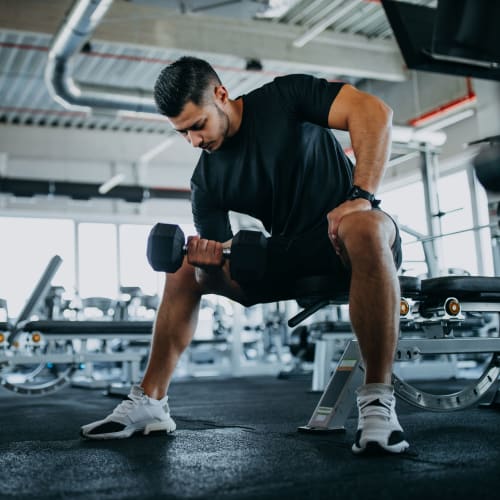 Resident lifting weights at Lake Pointe Apartments in Folsom, California