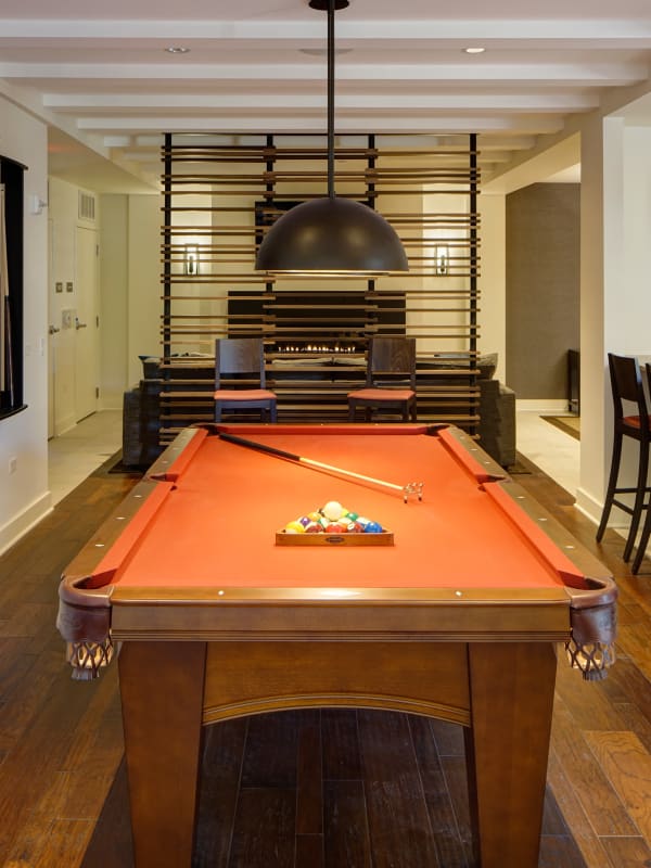 Community pool table and game room at Courthouse Square Apartments in Wheaton, Illinois