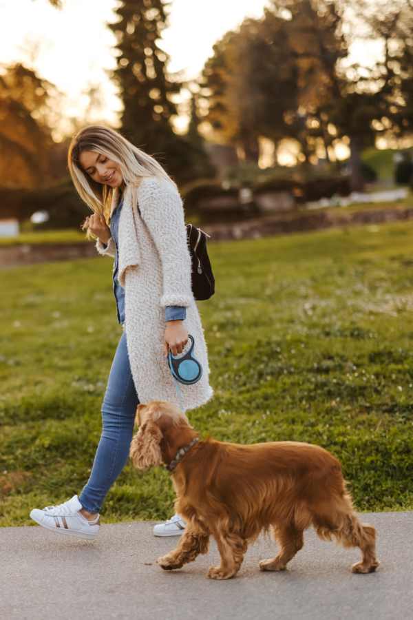 Resident walking with her dog near The Abbey At Enclave in Houston, Texas