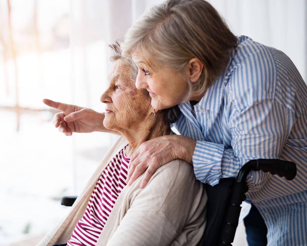 Memory care resident and caretaker at The Harmony Collection at Columbia Assisted Living & Memory Care in Columbia, South Carolina