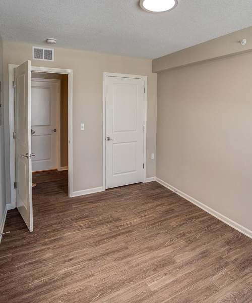 Bedroom with wood flooring at McKay Manor in Breese, Illinois