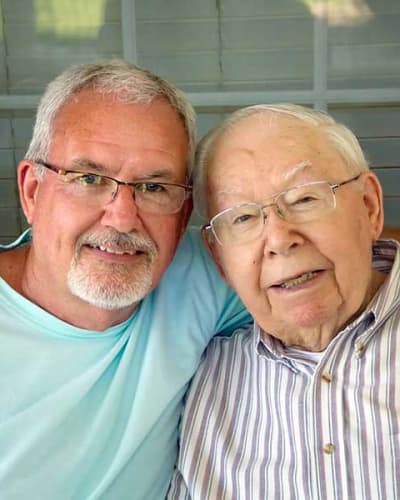 Resident with his son posing for a picture at Garden Place Millstadt in Millstadt, Illinois.