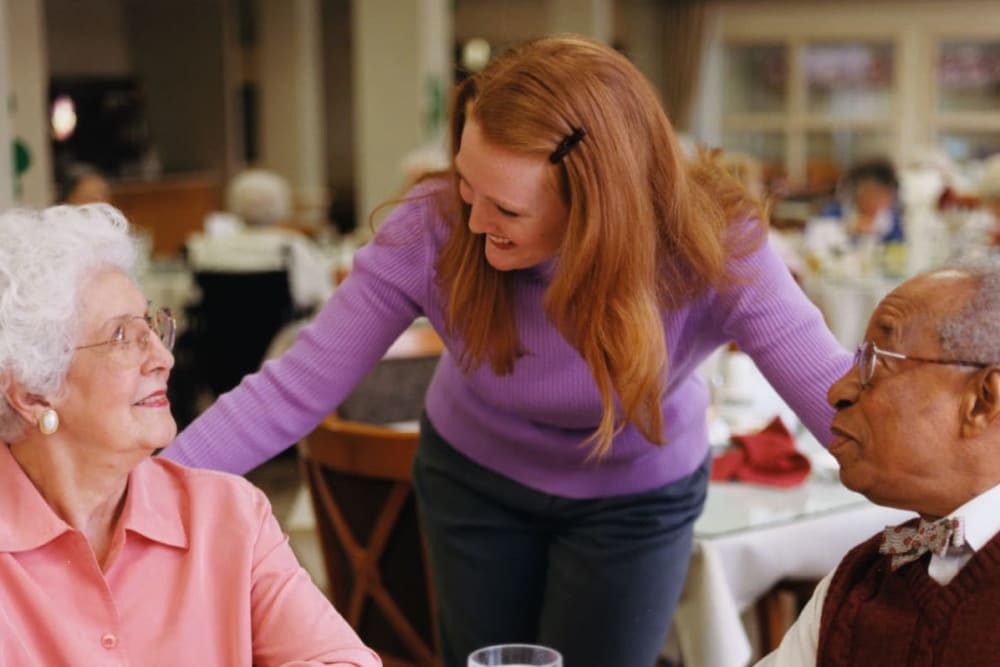Residents mingle with staff in dining room at Arbor View in Burlington, Wisconsin