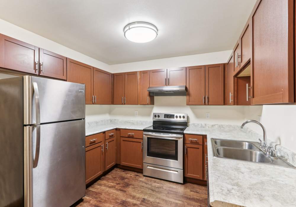 Kitchen with modern appliances at Woodfield Heights Apartments in Waukesha, Wisconsin