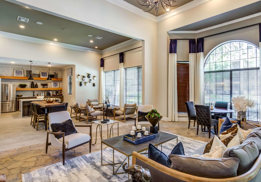 Community clubhouse with modern décor and a kitchen at Sola Westchase in Houston, Texas