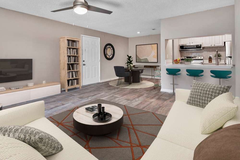 Living room with access to dining area at Isles at East Millenia in Orlando, Florida