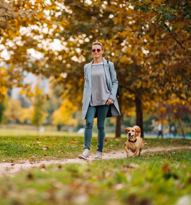 Resident walking her dog near Anthem on 12th in Seattle, Washington