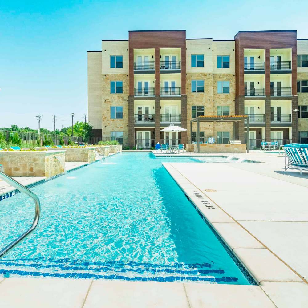 Resort style pool area at Millennium Place in Corinth, Texas