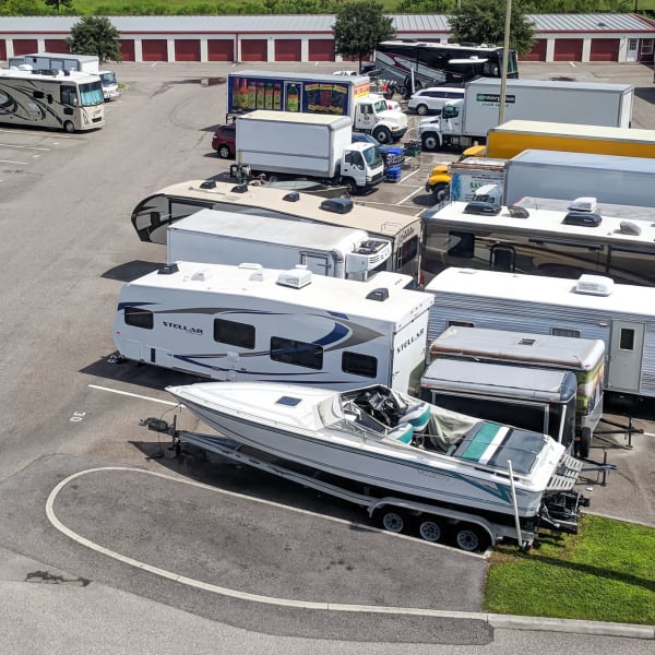 RVs, boats, trucks, and trailers parked at StorQuest Self Storage in Tempe, Arizona