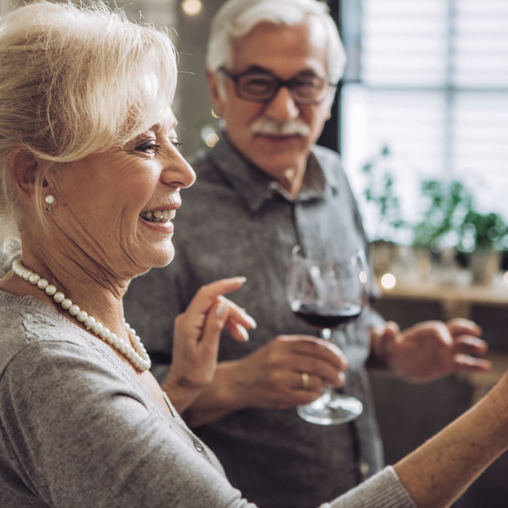Resident enjoying a glass of wine at Anthology of Simsbury in Simsbury, Connecticut