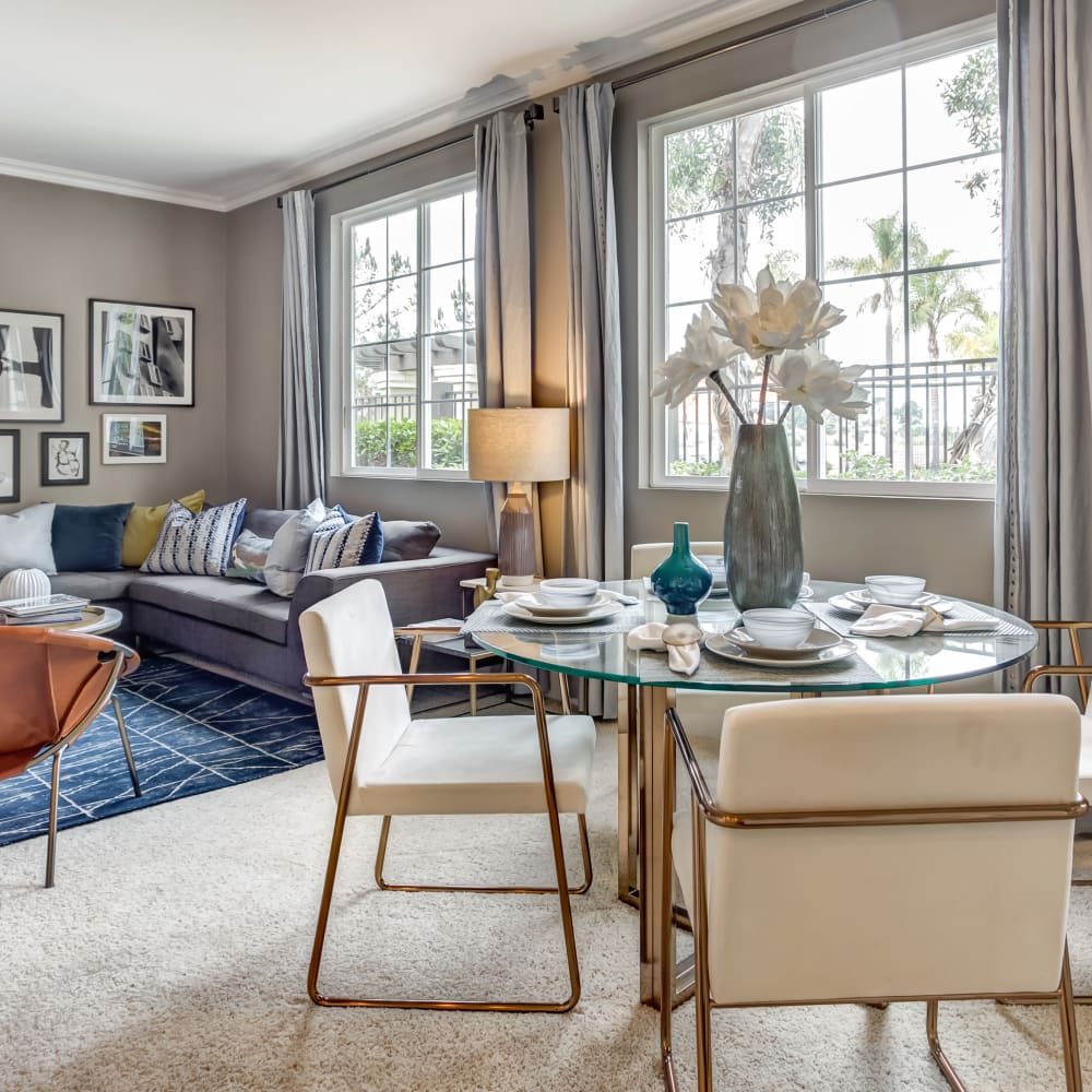 Spacious and modern open-concept floor plan with an accent wall in a model home at Sofi Highlands in San Diego, California