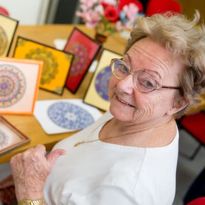 Resident creating art at Meadows on Fairview in Wyoming, Minnesota