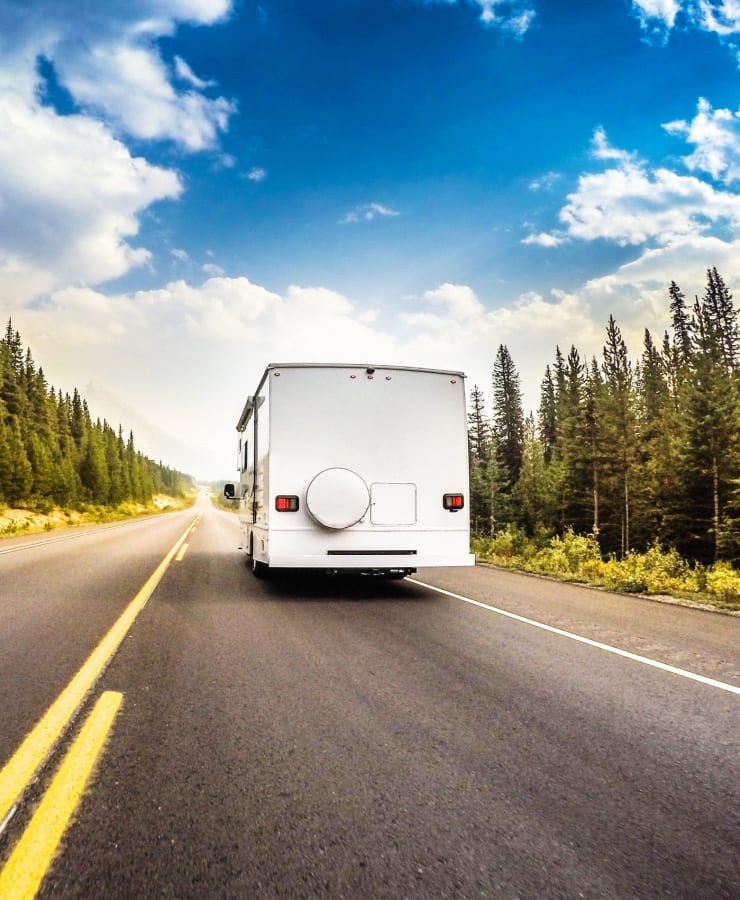 An RV driving down the road near StorQuest RV & Boat Storage in Wilsonville, Oregon