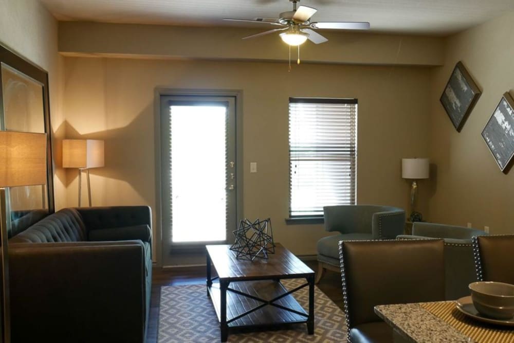Entrance and model living room of an apartment at The BLVD in San Angelo, Texas