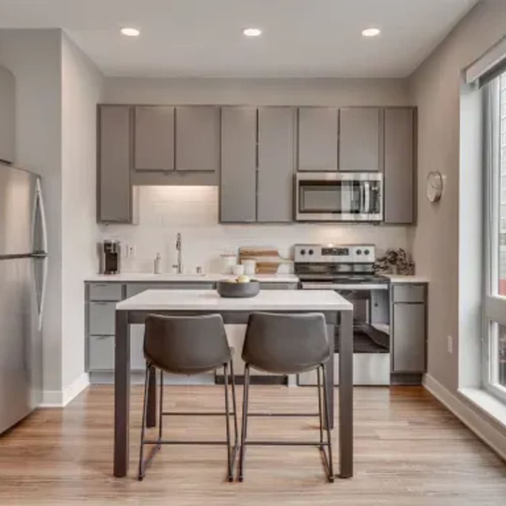 Model kitchen with grey accents at Marquee Living in Minneapolis, Minnesota