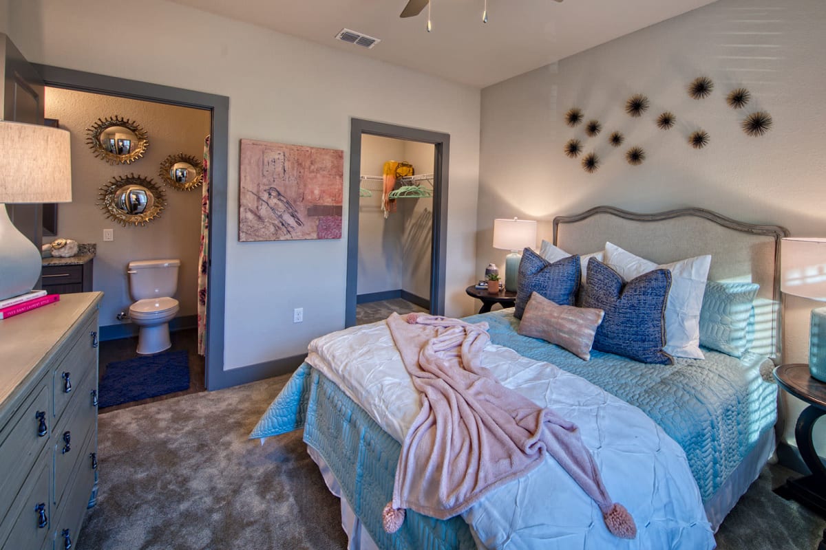 Furnished apartment bedroom with a walk-in closet at Lotus at Starkey Ranch in Odessa, Florida