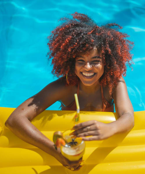 Resident relaxes in the pool at Playa Pacifica, Playa Del Rey, California 