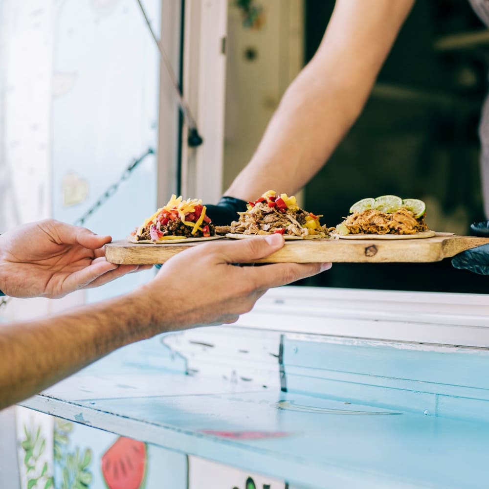 Resident getting his food from a food truck court near at Raven South End in Charlotte, North Carolina