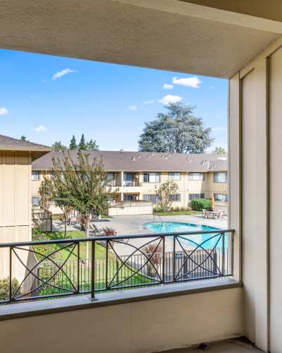 Balcony with pool view at Maplewood Apartment Homes, Mountain View, California