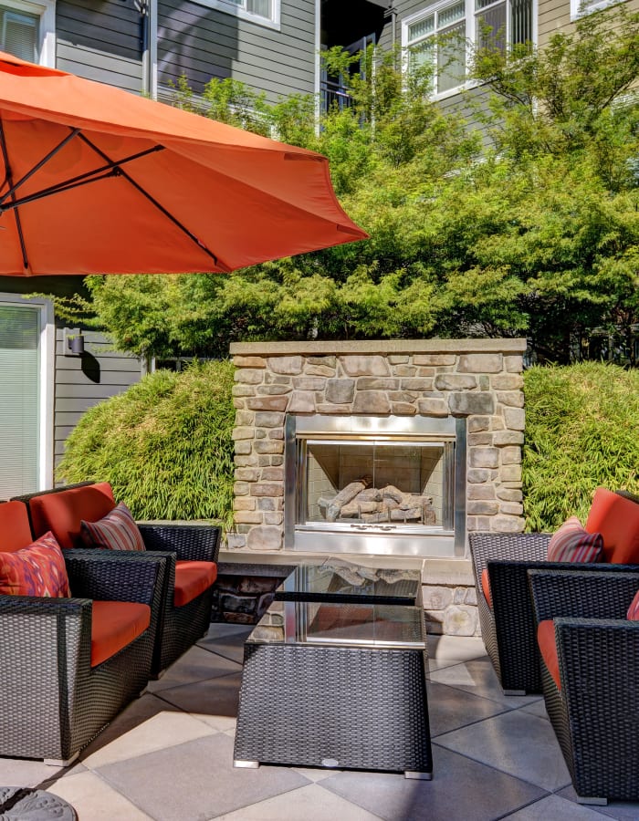 Outdoor fireplace at Chateau Woods Apartments