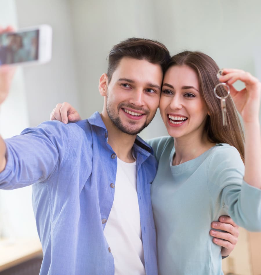 Couple taking a selfie in their new home at The Manor at Spring Lake