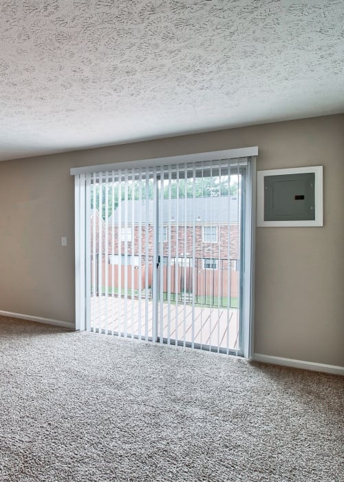 Living space with plush carpeting at Charlestown of Douglass Hills in Louisville, Kentucky