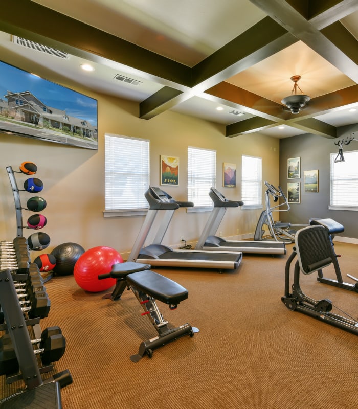 Fitness center at Cottages at Abbey Glen Apartments in Lubbock, Texas