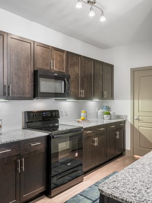 Gourmet kitchen with island at The Residences at Panther Hollow in Marble Falls, Texas