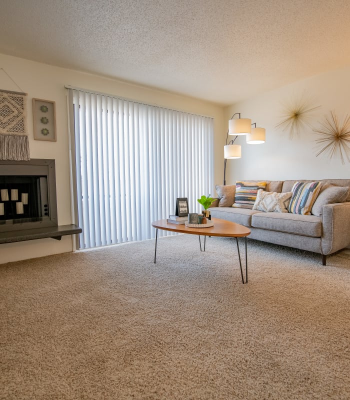 Carpeted living room at Council Place Apartments in Oklahoma City, Oklahoma