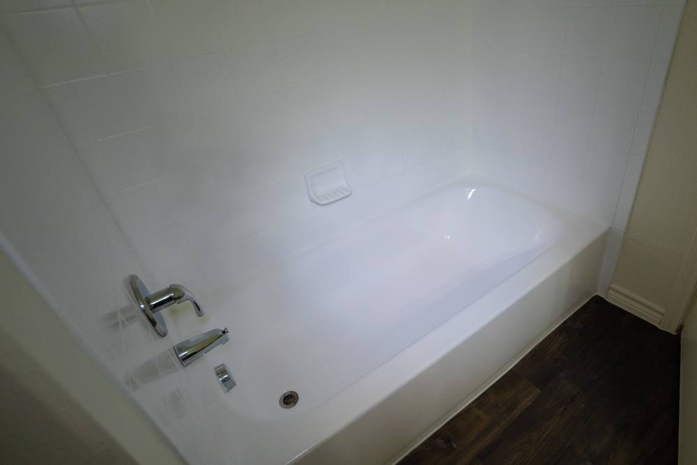 Bathroom with standard bathtub at Timber Village II in Marshall, Texas