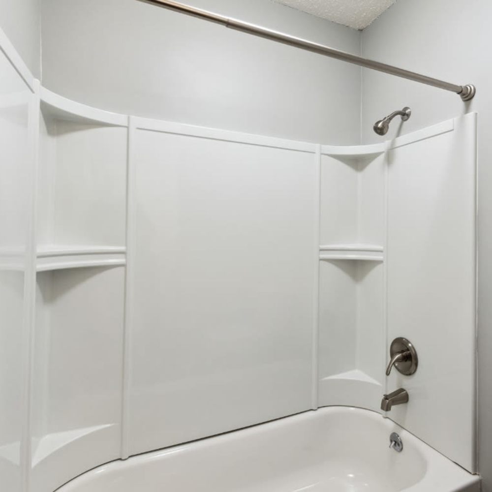 Bathroom with bathtub and shower at Meadow Glen Apartments in Springfield, Tennessee
