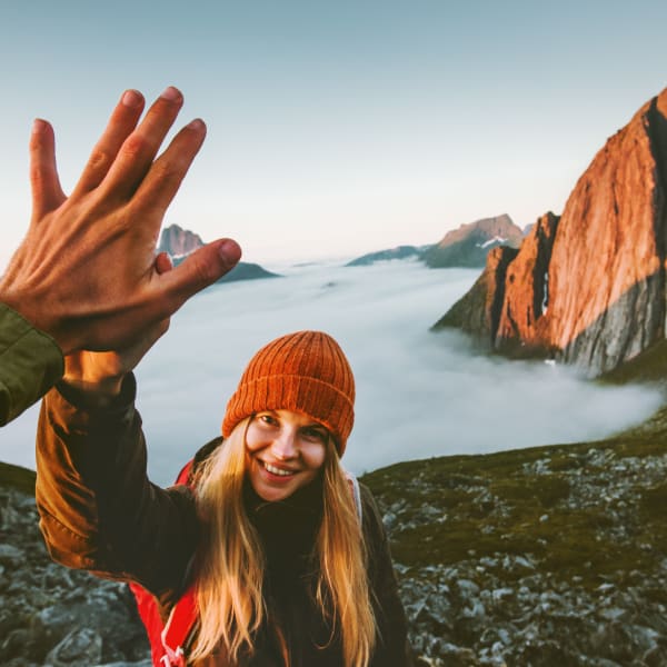 Residents high-fiving after finishing a hike near Olympus Rodeo in Santa Fe, New Mexico