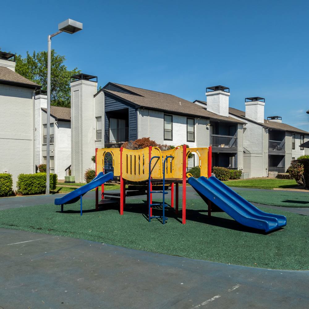 Community playground with slides at The Linden Apartments in Dallas, Texas