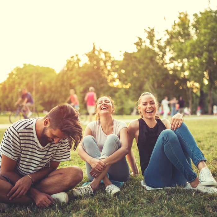 Friends having fun at the park near Burbank Apartments in Boston, Massachusetts
