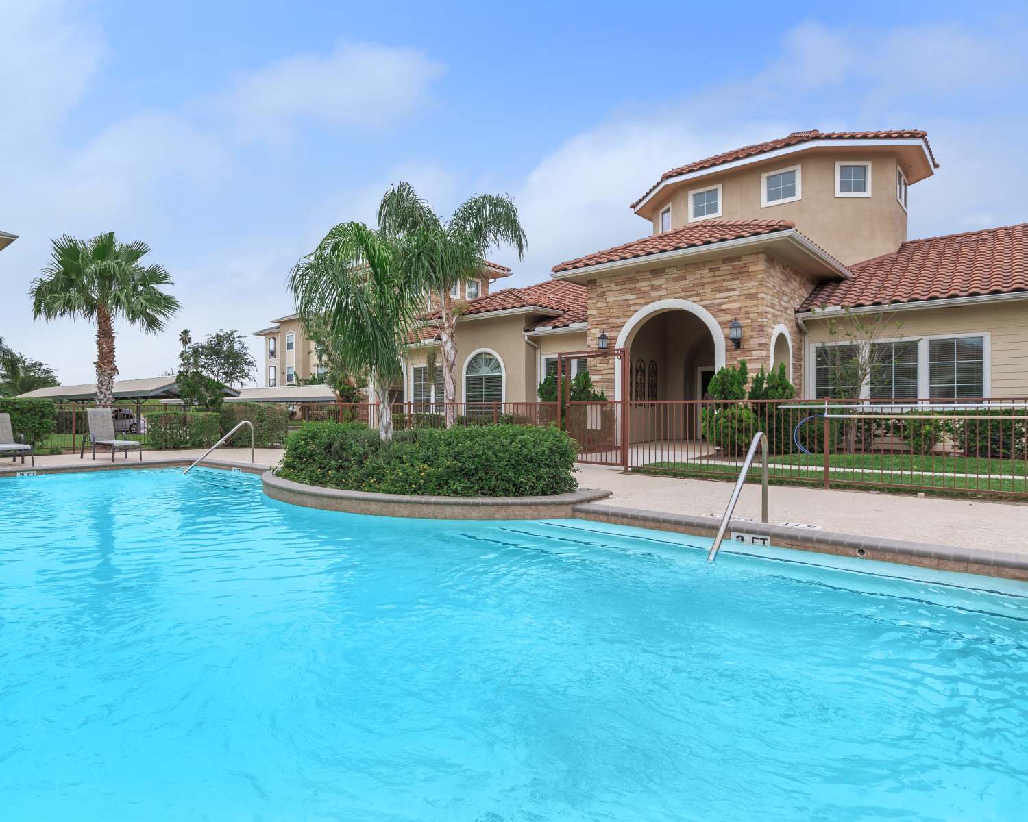 The sparkling community swimming pool at Weslaco Hills Apartments in Weslaco, Texas