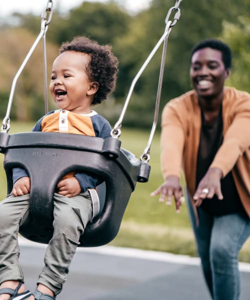 a mother playing with her child at a park near The Linq in Chandler, Arizona