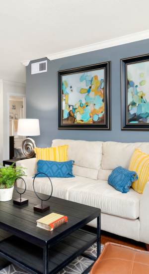 Living room with sofa and coffee table at The Abbey At Enclave in Houston, Texas