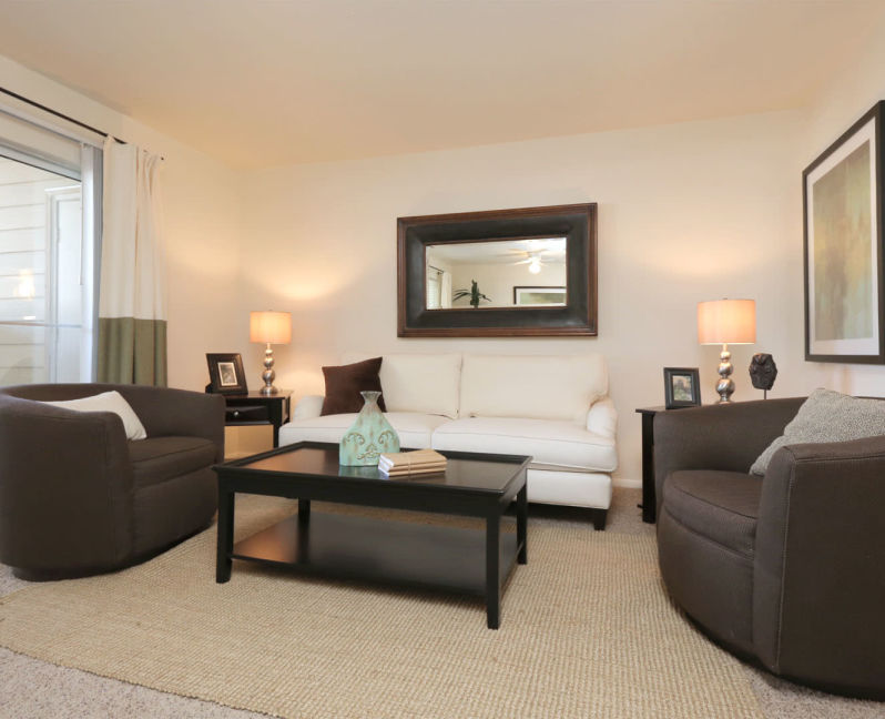 Comfortably decorated living area in a model home at Overlook Point Apartments in Salt Lake City, Utah