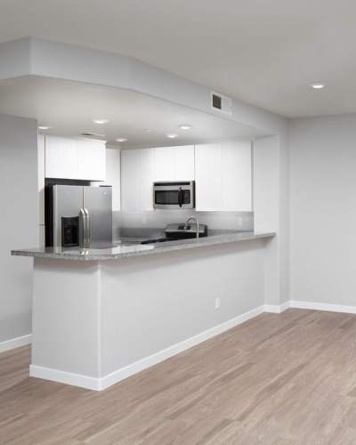 Apartment with wood-style flooring at The Parker Residences, San Diego, California