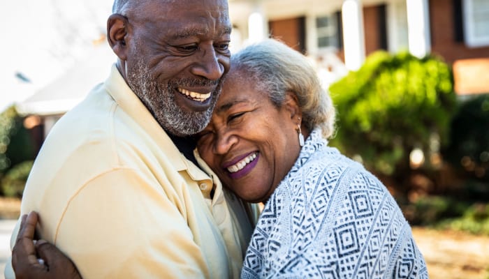 Residents embracing at an Estoria Cooperatives community